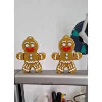 Parıltılı kahverengi, eklemli, zencefilli kurabiye adam figürü.