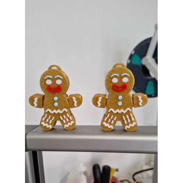 Parıltılı kahverengi, eklemli, zencefilli kurabiye adam figürü.