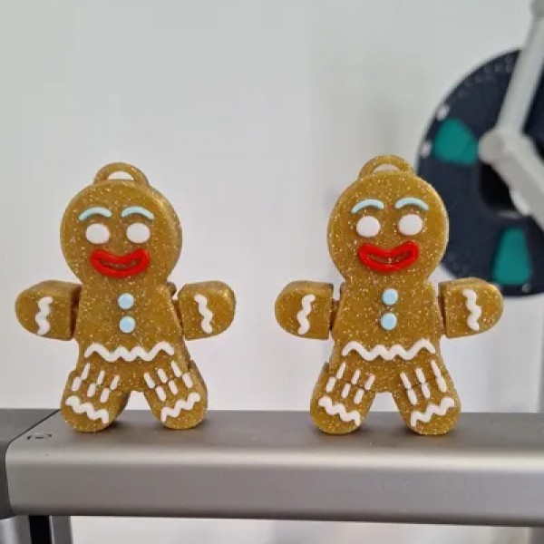 Parıltılı kahverengi, eklemli, zencefilli kurabiye adam figürü. Parıltılı kahverengi, eklemli, zencefilli kurabiye adam figürü.